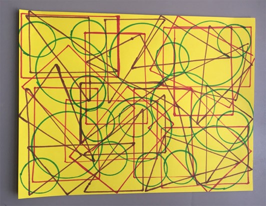 Colorful tracings of different shaped objects on bright yellow paper.