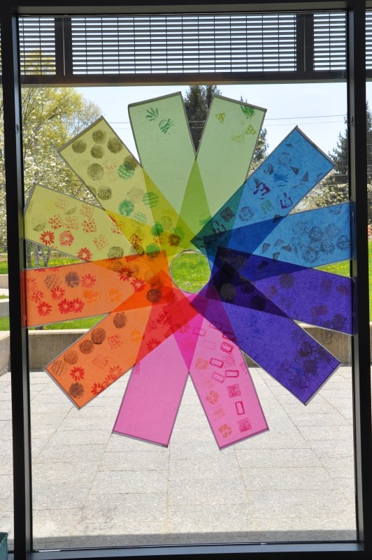 Display fitting inside one window pane with the colors shining as the sun comes through it.